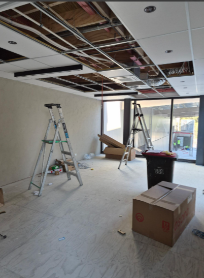 Ceiling panels going in for one of the offices Grace Removals, Porirua, Wellington 2026